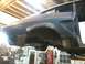 1978 Ford Mustang II - This vehicle's rear quarter panel shows significant rust damage and is undergoing repair. The Supermotors.net logo is visible in the lower…