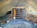 1990 Ford Bronco - Close-up of a vehicle's front suspension system with shock and coil spring.