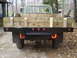 1979 Ford Bronco - Rear view of a flatbed truck, likely from the late 1970s, with a custom wooden bed.