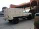 2004 Ford F-150 - Service truck with utility body parked outside a building, hood is open.