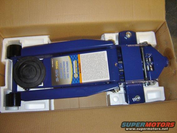 Blue hydraulic floor jack in box