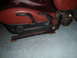 1991 BMW 3 Series - Close-up view of a red leather car seat, showing its interior components and adjustment mechanisms.