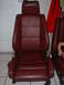 1991 BMW 3 Series - A pair of maroon leather car seats are shown, with one seat in the foreground and another partially visible to the right.