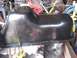 1996 Ford Bronco - A black oil pan is shown, likely a replacement part for a vehicle.