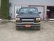 1996 Ford Bronco - This Ford F-150 pickup truck is parked in front of a garage with a bull bar and an elementary school license plate.