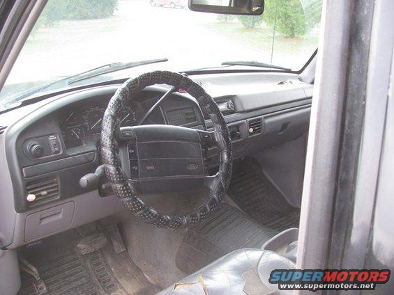 Interior view of a 1992 Ford F-Series truck dashboard and steering wheel