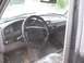 1996 Ford Bronco - Interior of a 1992 Ford F-Series truck, showing the dashboard, steering wheel, and floor mats.
