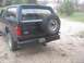 1996 Ford Bronco - The rear of a black 1996 Ford Bronco is shown, complete with a spare tire and a license plate.
