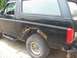 1996 Ford Bronco - This 1996 Ford Bronco displays extensive rust damage, particularly on its rear fender and lower body panels.