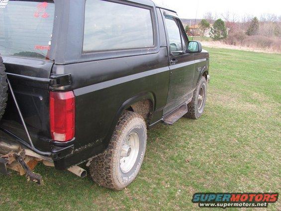 Black 1996 Ford Bronco rear quarter panel and side view