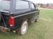 1996 Ford Bronco - This 1996 Ford Bronco is viewed from the rear quarter panel, showing its side profile and off-road tires.