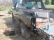 1996 Ford Bronco - Ford Bronco undergoing repairs in an outdoor setting, with tools and equipment nearby.