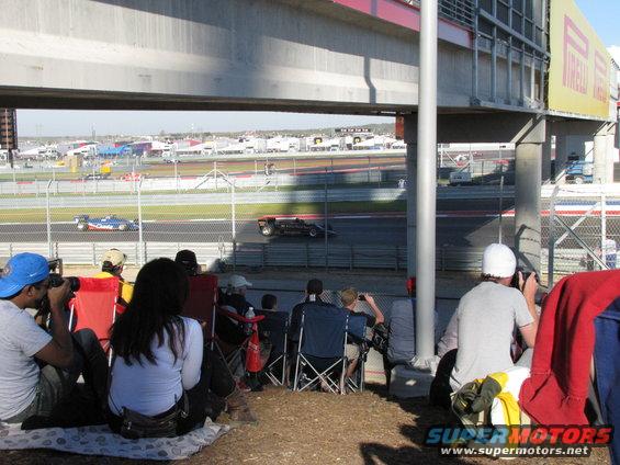 Spectators watch race cars on a track at Circuit of the Americas