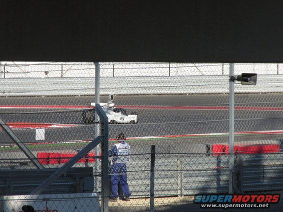 White race car with number 8 on its side on a track