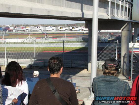 View of a race track with spectators in the foreground