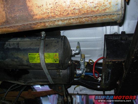 16oba26.jpg It's tight, but there's room to work with the air fittings, or install/remove the aux.batt for fuel filter access.