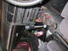 1993 Mazda MX-3 - The interior of a car with the center console disassembled to install a short shifter.