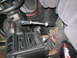 1993 Mazda MX-3 - Modified gear shifter assembly with exposed wiring and aftermarket pedals in a vehicle interior.