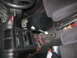 1993 Mazda MX-3 - Interior view of a car's center console with a modified shifter and exposed wiring.