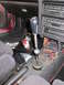 1993 Mazda MX-3 - The interior of a car shows an aftermarket short shifter with a carbon fiber knob and an extended shaft.