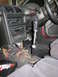 1993 Mazda MX-3 - Interior of a 1993 Mazda MX-3, an aftermarket short shifter and exposed wiring under the console.