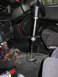 1993 Mazda MX-3 - The interior of a car features a modified shifter and exposed wiring under the dashboard.