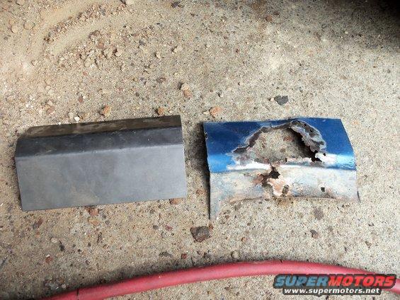 Rusted blue car door panel with large hole next to a grey metal trim piece on concrete