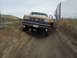 1988 Ford F-250 - Ford F-250 4x4 navigating a challenging dirt path.