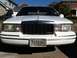 1997 Lincoln Town Car - Front view of a white 1997 Lincoln Town Car parked outdoors.