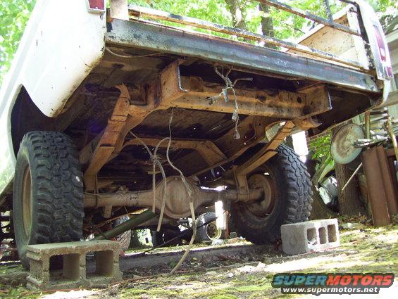 1972 Ford F-150 rear undercarriage, white, rusty, on cinder blocks