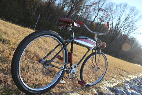 Cruiser bicycle with red handlebars and a chrome and red tank