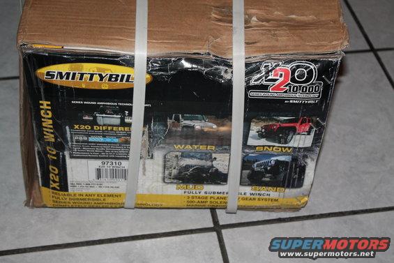 Smittybilt X20 10,000 winch box with images of Jeeps in water, mud, snow, and sand
