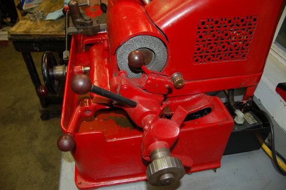 Red key cutting machine with grinding wheel and handles