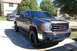 2007 GMC Sierra 1500 - Front 3/4 view of a brown 2007 GMC Sierra 1500 pickup truck.