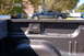 2007 GMC Sierra 1500 - A dark blue pickup truck is parked on the street, seen from the perspective of its own truck bed.