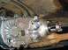 1995 Jeep Wrangler - Underside view of a vehicle's transfer case and driveshaft, showing mechanical components.