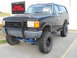 1992 Ford Bronco - This lifted 1992 Ford Bronco features off-road tires and a custom grille guard.