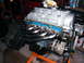 2004 Ford Crown Victoria - V8 engine assembly with custom headers and alternator, likely for a performance build.