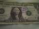 2003 Ford Crown Victoria - A one dollar bill is stamped with the words 'I GROW HEMP'.