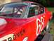 1968 Ford Torino - A red race car with the number 68 prominently displayed on its side is parked on a trailer.