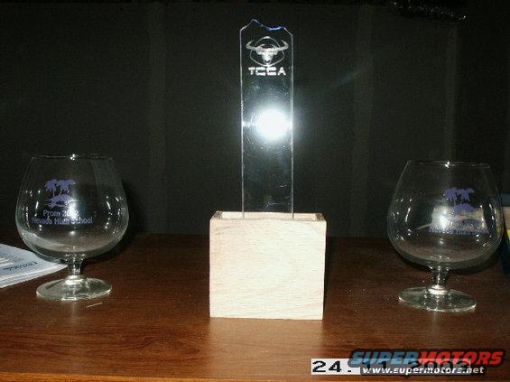 Trophy with TCCA logo and two glasses with 'Prom 2002 Nevada High School' text