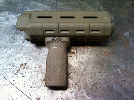 Tan vertical foregrip with rail attachment, marked 'MDT'