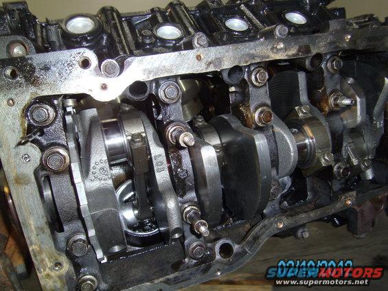 Engine crankshaft and connecting rods with visible text 'LOB'