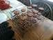 1990 Ford Bronco - Freshly baked cookies are cooling on a wire rack on a wooden table.