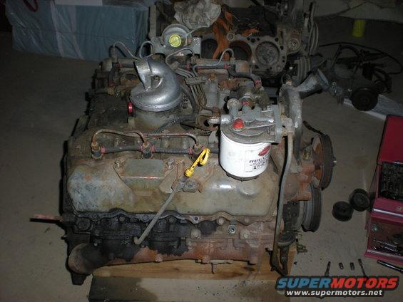 Diesel engine with turbocharger and oil filter. Readable text on filter