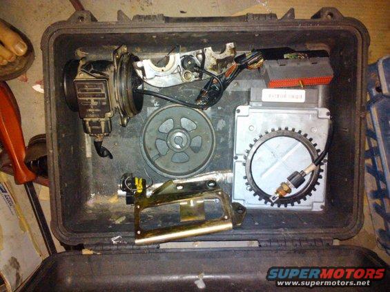 Engine control unit, sensor, and other engine parts laid out in a black case