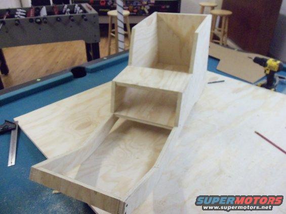Wooden structure on pool table with Supermotors.net logo