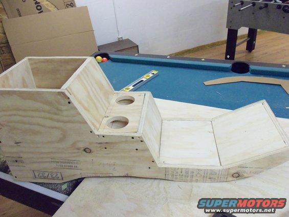 Unfinished wooden center console with two cup holders and storage compartments
