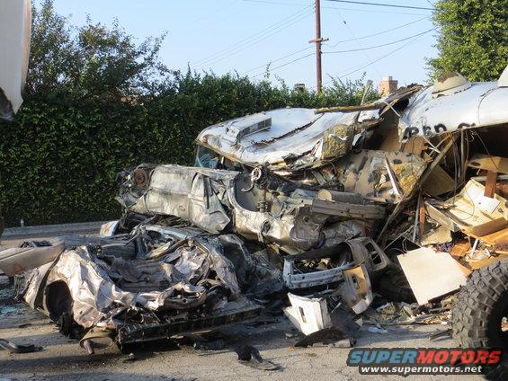 Pile of mangled car wreckage, looks like a multi-car crash aftermath