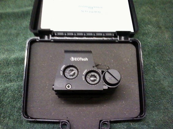 EOtech sight with "UP" and "DOWN" dials in open case